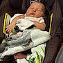 baby, blanket, car_seat, child, child_safety, comfort, cozy, cute, indoors, infant, nap, peaceful, person, rest, seat, sleeping, small, soft, toddler, wrapped
