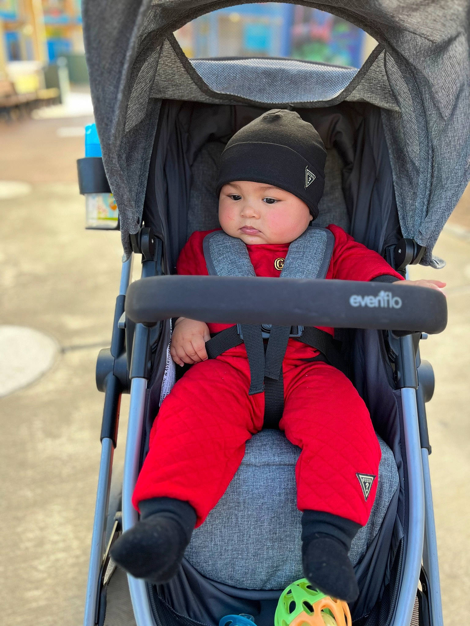Wesley Javier Marti Ramos is registered to the contest to win money with this photo: baby, baby_carriage, baby_products, carmine, child, comfort, electric_blue, fun, green, hat, headwear, lap, leisure, person, photograph, product, recreation, sitting, snapshot, tire