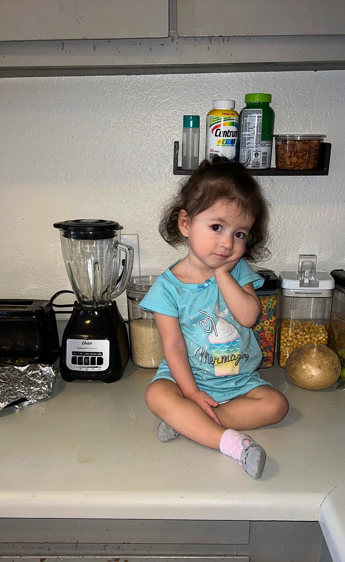 Leila is registered to the contest to win money with this photo: baby_toddler_clothing, blender, child, cooking, drinkware, fun, gas, home_appliance, homemaker, kitchen, kitchen_appliance, lighting, mixer, person, room, scale, serveware, shorts, t_shirt, tableware