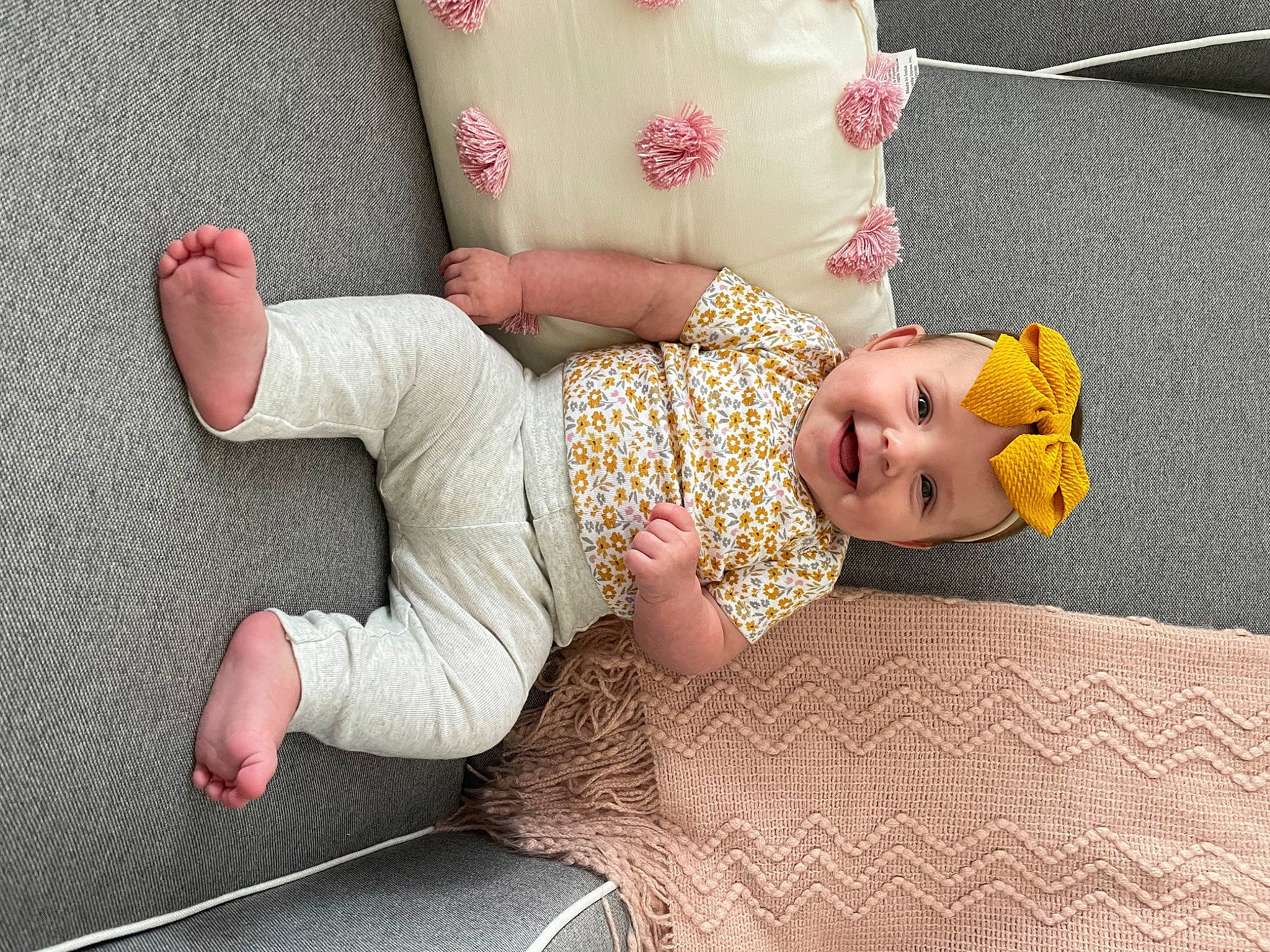 Gatlynn is registered to the contest to win money with this photo: baby, baby_toddler_clothing, child, comfort, dress, finger, floor, flooring, hat, headgear, headwear, human_body, joint, joy, linens, pattern, person, pink, skin, sleeve