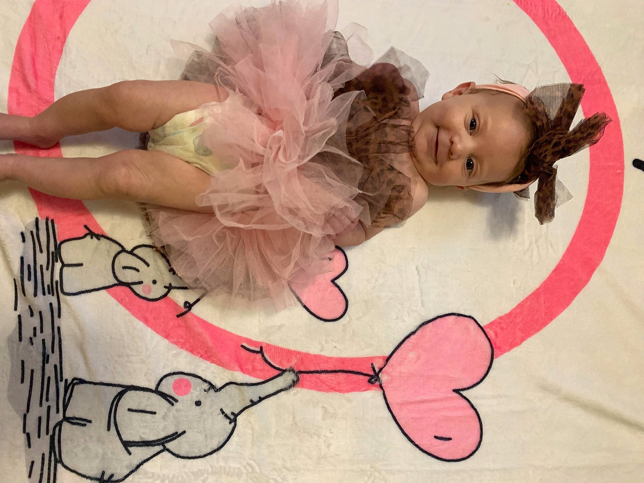 Willow is registered to the contest to win money with this photo: art, baby, baby_toddler_clothing, bangs, child, circle, eyelash, fashion_accessory, font, fun, happy, headpiece, joy, magenta, musical_instrument, pattern, person, pink, smile, textile