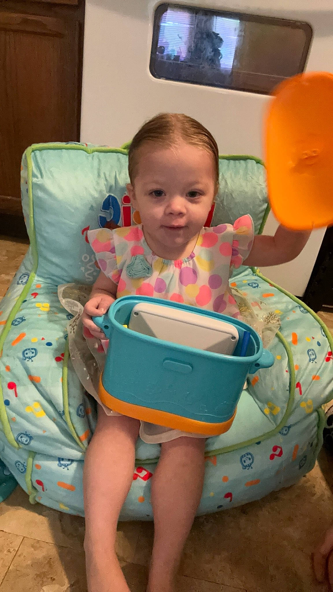 Harleigh is registered to the contest to win money with this photo: baby, baby_toddler_clothing, child, comfort, flooring, fun, happy, leisure, person, plastic, play, product, room, sitting, skin, smile, television, television_set, thigh, toddler