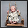 baby, infant, swing, wooden_swing, ropes, pajamas, cozy, striped_clothing, barefoot, gray_background, cute, child, portrait, indoor, newborn, seated, hands, feet, wood, baby_clothes