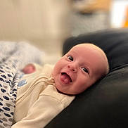 Edward joined the competition — help win amazing prizes! baby, infant, smiling, blanket, couch, indoor, happy, face, head, clothing, cozy, portrait, child, young, cute, comfortable, home, soft, expression, resting