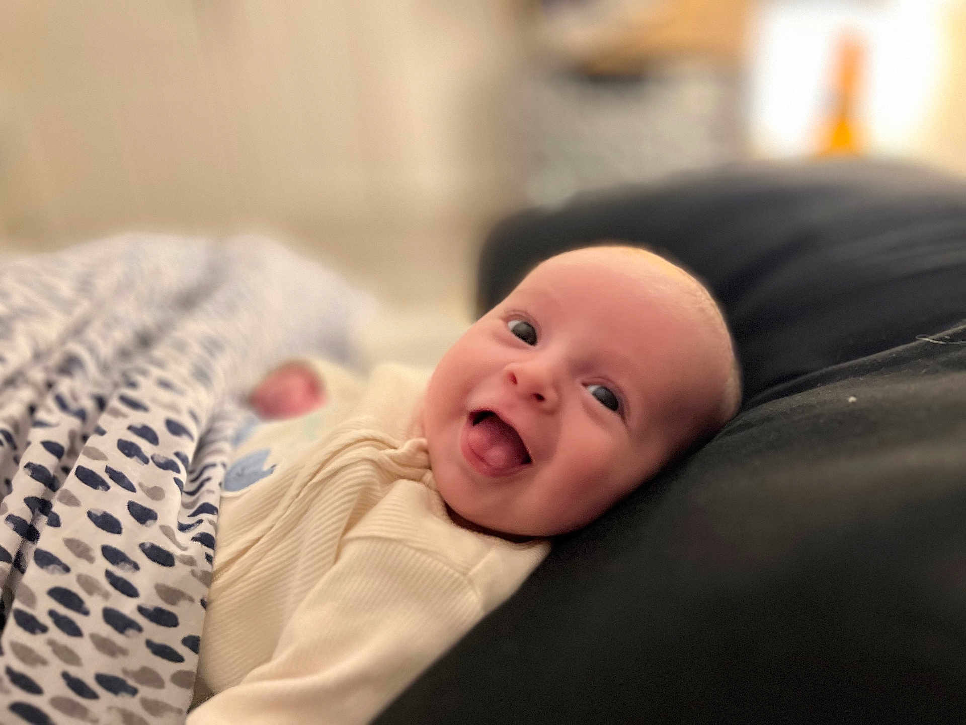 Edward joined the competition — help win amazing prizes! baby, infant, smiling, blanket, couch, indoor, happy, face, head, clothing, cozy, portrait, child, young, cute, comfortable, home, soft, expression, resting