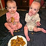 baby, babies, child, children, cookie, chocolate_chip_cookie, food, messy, indoor, sitting, pink_clothing, cream_clothing, cute, face, hands, plate, floor, playful, happy, infant