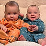 Logan joined the competition — help win amazing prizes! baby, babies, child, infant, onesie, orange_clothing, blue_clothing, plush_chair, cute, smiling, sitting, indoors, foot, hand, face, happy, together, young, cozy, portrait