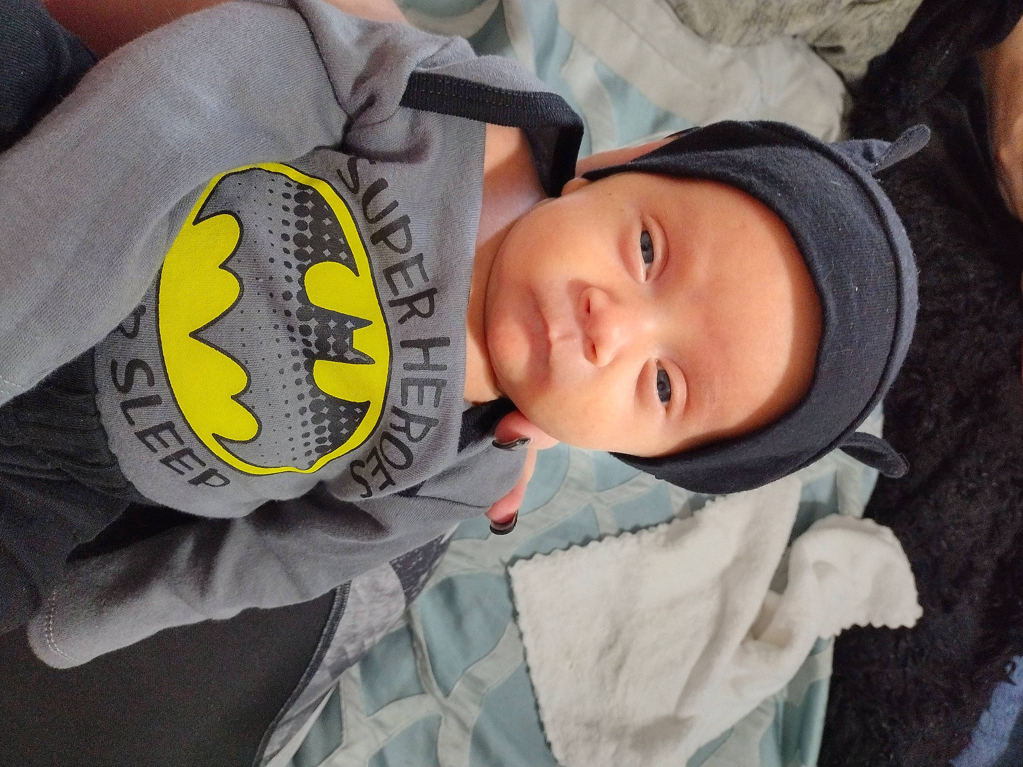 Carter joined the competition — help win amazing prizes! baby, baby_products, baby_toddler_clothing, beanie, car_seat, cheek, child, comfort, fur, headwear, hoodie, knit_cap, logo, mouth, person, personal_protective_equipment, sleeve, thumb, toddler, tree