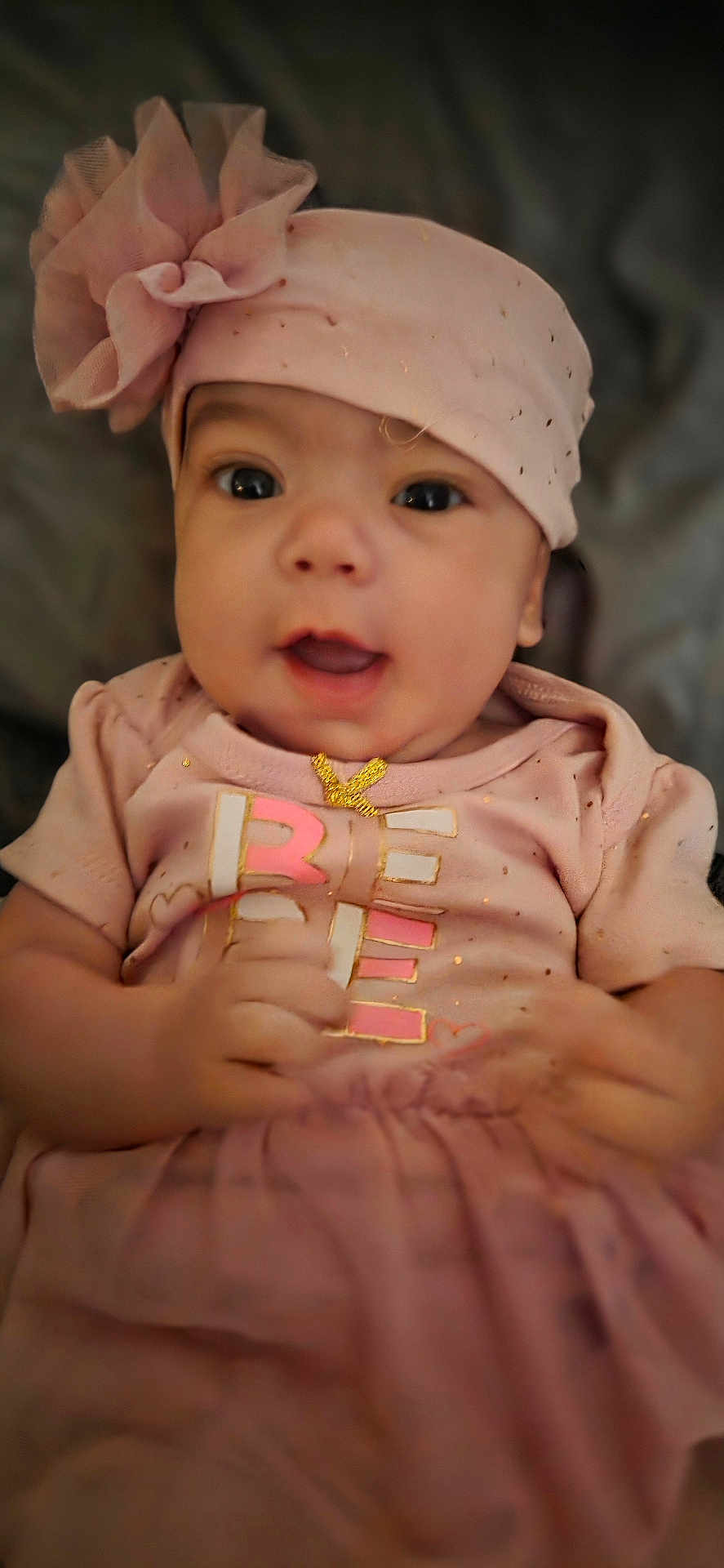 Amelia joined the competition — help win amazing prizes! baby, child, pink, headband, flower, clothing, smile, face, portrait, infant, cute, happy, toddler, soft_focus, indoors, person, apparel, fabric, closeup, skin