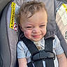 Kehlani is registered to the contest to win money with this photo: toddler, child, car_seat, smile, straps, gray, clothing, hair, seatbelt, cute, baby, infant, portrait, happy, sitting, safety, seat, young_child, person, casual