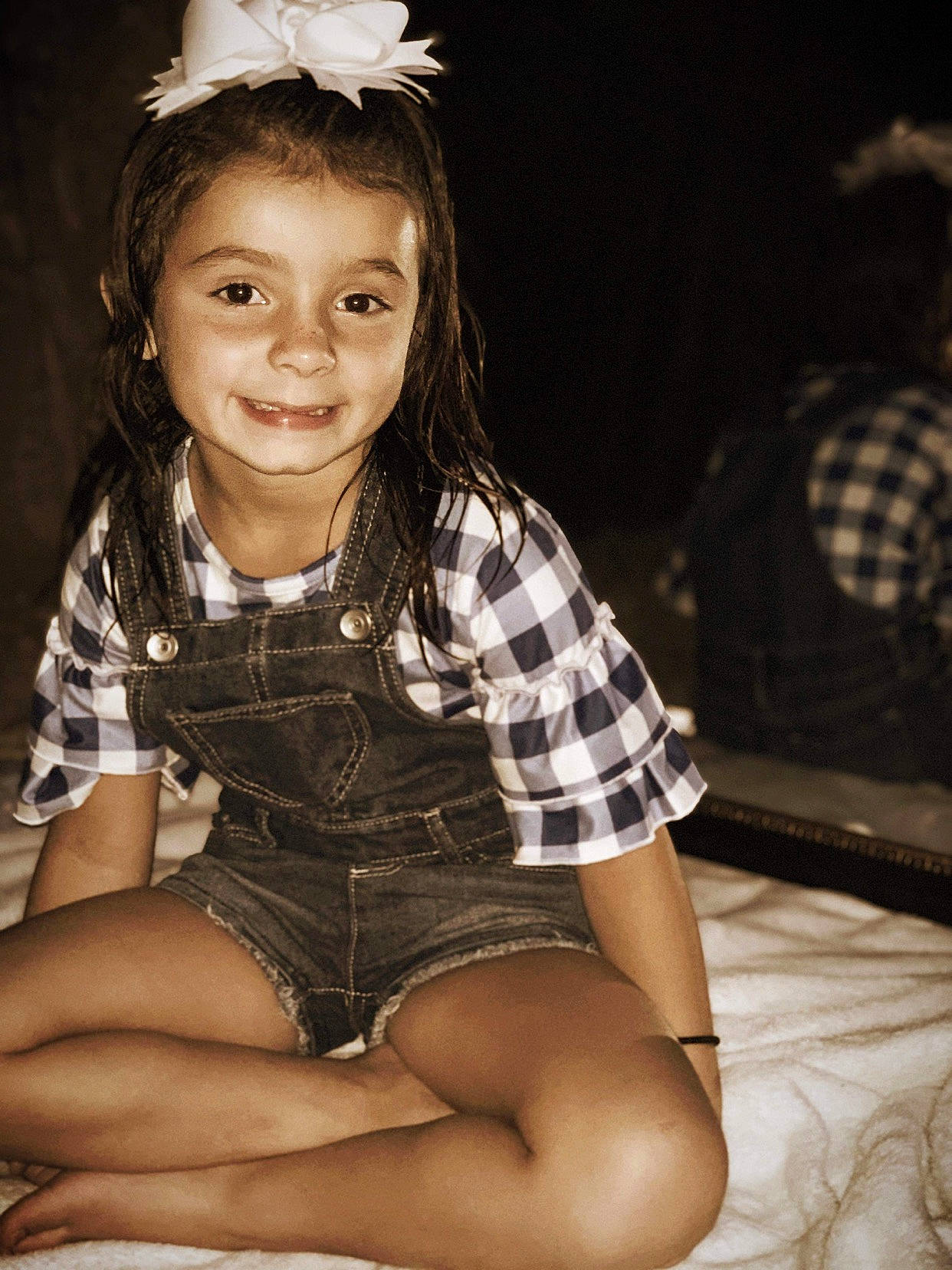 Avi is registered to the contest to win money with this photo: beauty, black_hair, brown_hair, child, child_model, flash_photography, hair, hairstyle, human_body, joy, leg, long_hair, pattern, person, photography, plaid, sitting, smile, thigh, toddler