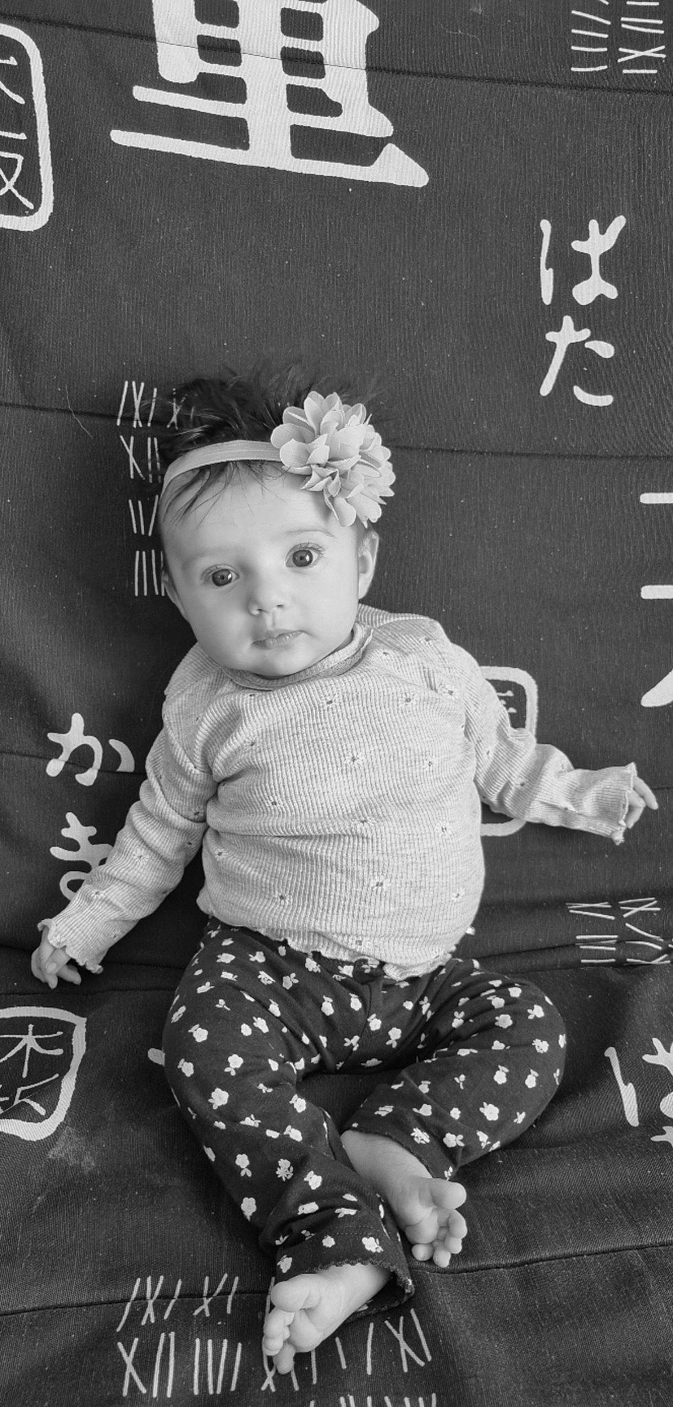 Hannah participe au concours pour gagner de l'argent avec cette photo : baby, baby_toddler_clothing, black, black_and_white, child, doll, hairstyle, happy, monochrome, monochrome_photography, pattern, person, photograph, sitting, sleeve, snapshot, style, toddler, toy, vintage_clothing