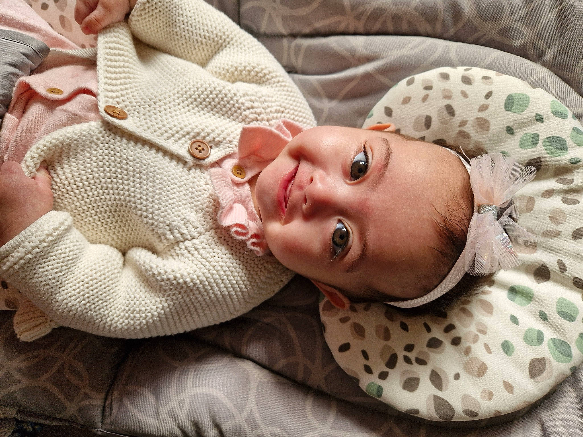 Emily is registered to the contest to win money with this photo: baby, baby_products, baby_safety, baby_sleeping, baby_toddler_clothing, cheek, child, comfort, eye, facial_expression, headgear, linens, lip, mouth, nose, pattern, person, skin, sleeve, smile