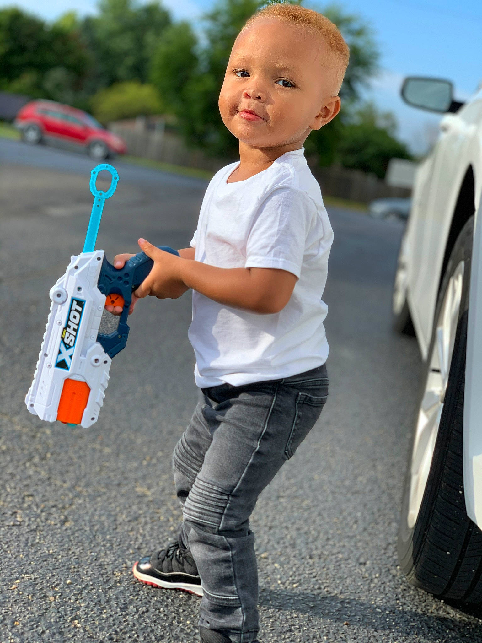 Nyaire joined the competition — help win amazing prizes! alloy_wheel, auto_part, automotive_design, automotive_exterior, automotive_tire, automotive_wheel_system, denim, fender, luxury_vehicle, person, play, rim, standing, street_fashion, sweatpant, t_shirt, toy, toy_vehicle, vehicle_door, walking_shoe