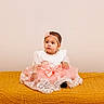 Legacie joined the competition — help win amazing prizes! baby, girl, dress, lace, headband, flower, sitting, blanket, mustard_yellow, textured, indoors, portrait, child, cute, fashion, young, adorable, soft_lighting, neutral_background, sole_subject