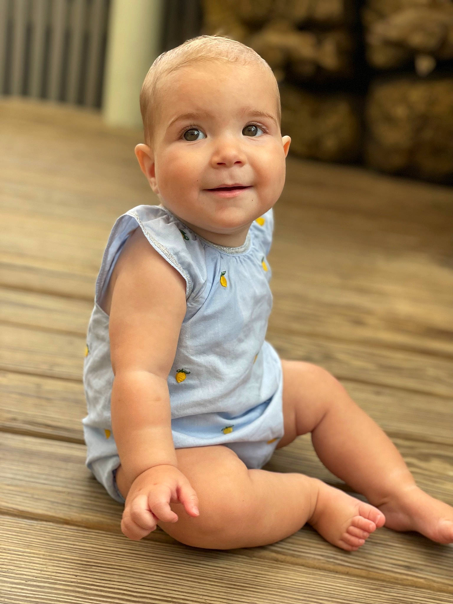 Isla joined the competition — help win amazing prizes! baby, baby_toddler_clothing, cheek, child, eye, face, flash_photography, floor, flooring, foot, happy, human_leg, iris, joy, person, sitting, skin, sleeve, smile, standing