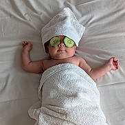 Jean participe au concours pour gagner de l'argent avec cette photo : baby, towel, cucumber, spa, relaxation, bed, white, skin, face, child, wrapped, cute, sleeping, soft, blanket, resting, health, wellness, indoor, peaceful
