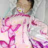 Amelia joined the competition — help win amazing prizes! baby, sleeping, infant, pacifier, blanket, pink, butterflies, portrait, cozy, nursery, bedding, patterned, seated, indoors, relaxed, cute, face, head, child, textile