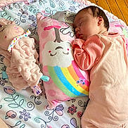 Adalynn is registered to the contest to win money with this photo: baby, blanket, child, colorful, cozy, cute, floor, indoors, infant, nap, patterned_blanket, peaceful, pillow, pink_clothing, plush_toy, resting, sleeping, soft_toy, toddler, wooden_floor