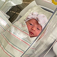 Adalynn joined the competition — help win amazing prizes! newborn, baby, hospital, blanket, bassinet, swaddled, infant, hat, striped, resting, cute, sleepy, portrait, closeup, person, bed, medical, crib, soft, wrapped