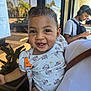 Amarís is registered to the contest to win money with this photo: baby, child, clothing, cute, earrings, face, hand, happy, head, headphones, holding, minnie_mouse, outdoor, pattern, person, phone, reflection, smiling, sunlight, toddler