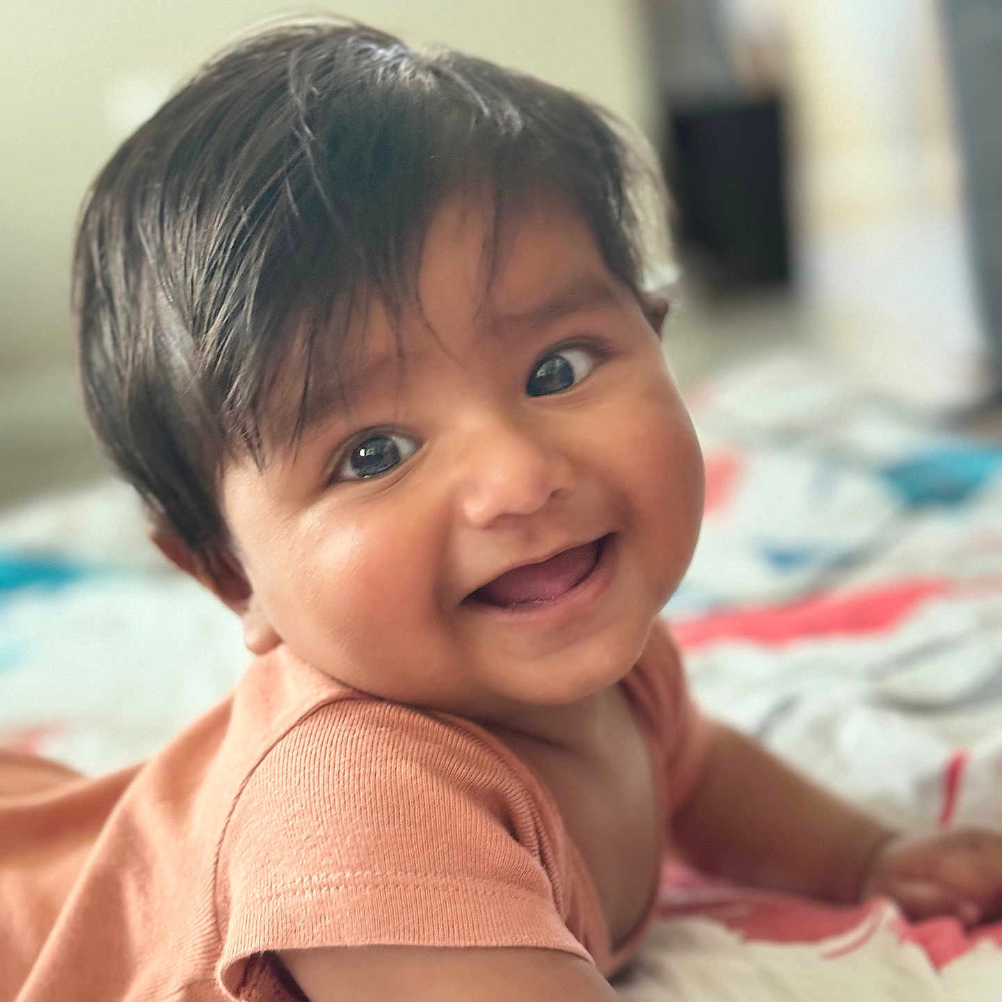 Arjun is registered to the contest to win money with this photo: baby, babylaughing, bed, bedroom, bodypart, face, finger, furniture, hair, hand, happy, head, indoors, laughing, mouth, person, photography, portrait, room, smile