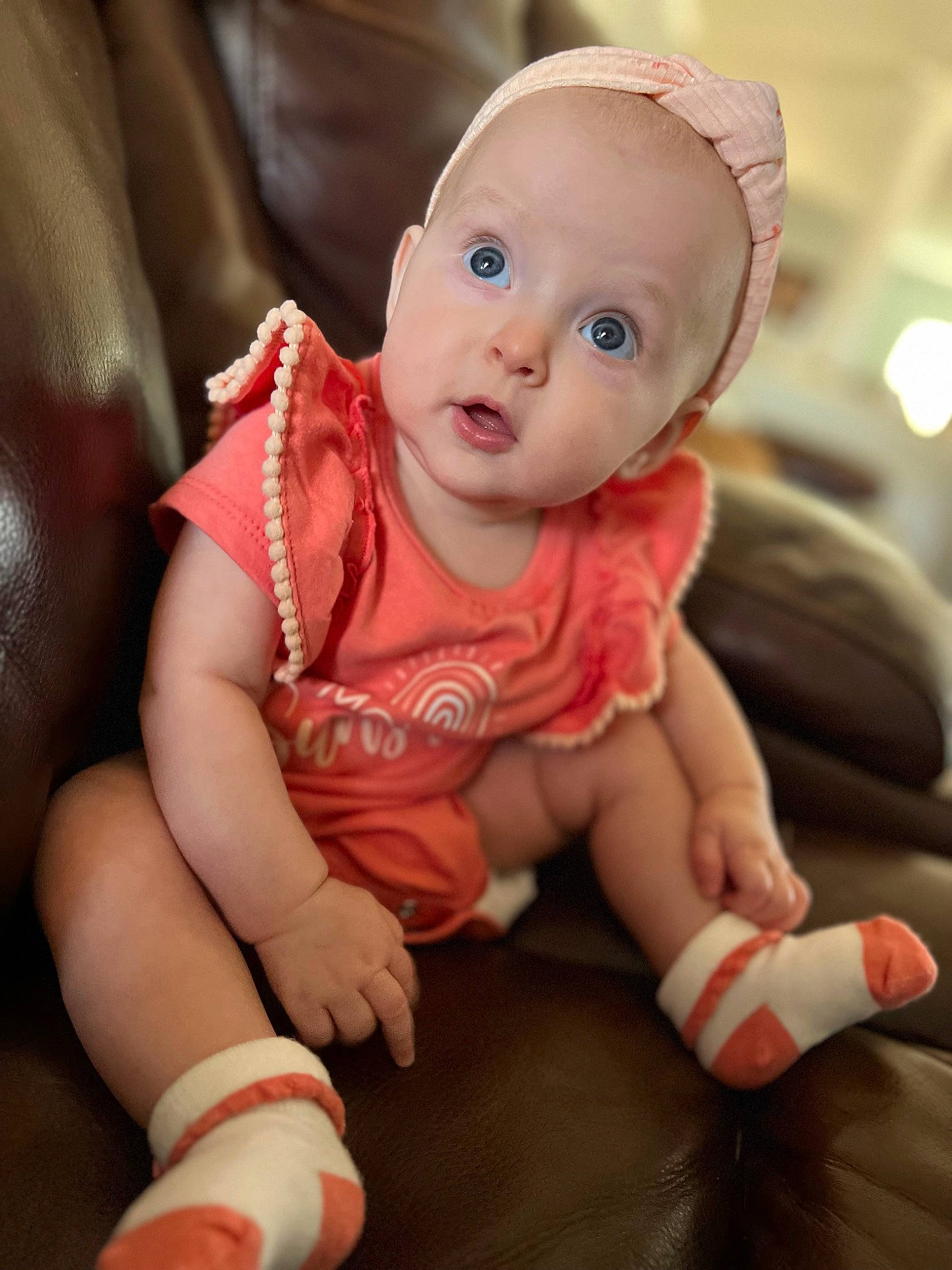 Arden joined the competition — help win amazing prizes! baby, baby_toddler_clothing, cheek, child, comfort, doll, finger, foot, fun, human_body, human_leg, joint, person, pink, sitting, skin, sleeve, sock, surprise, thumb