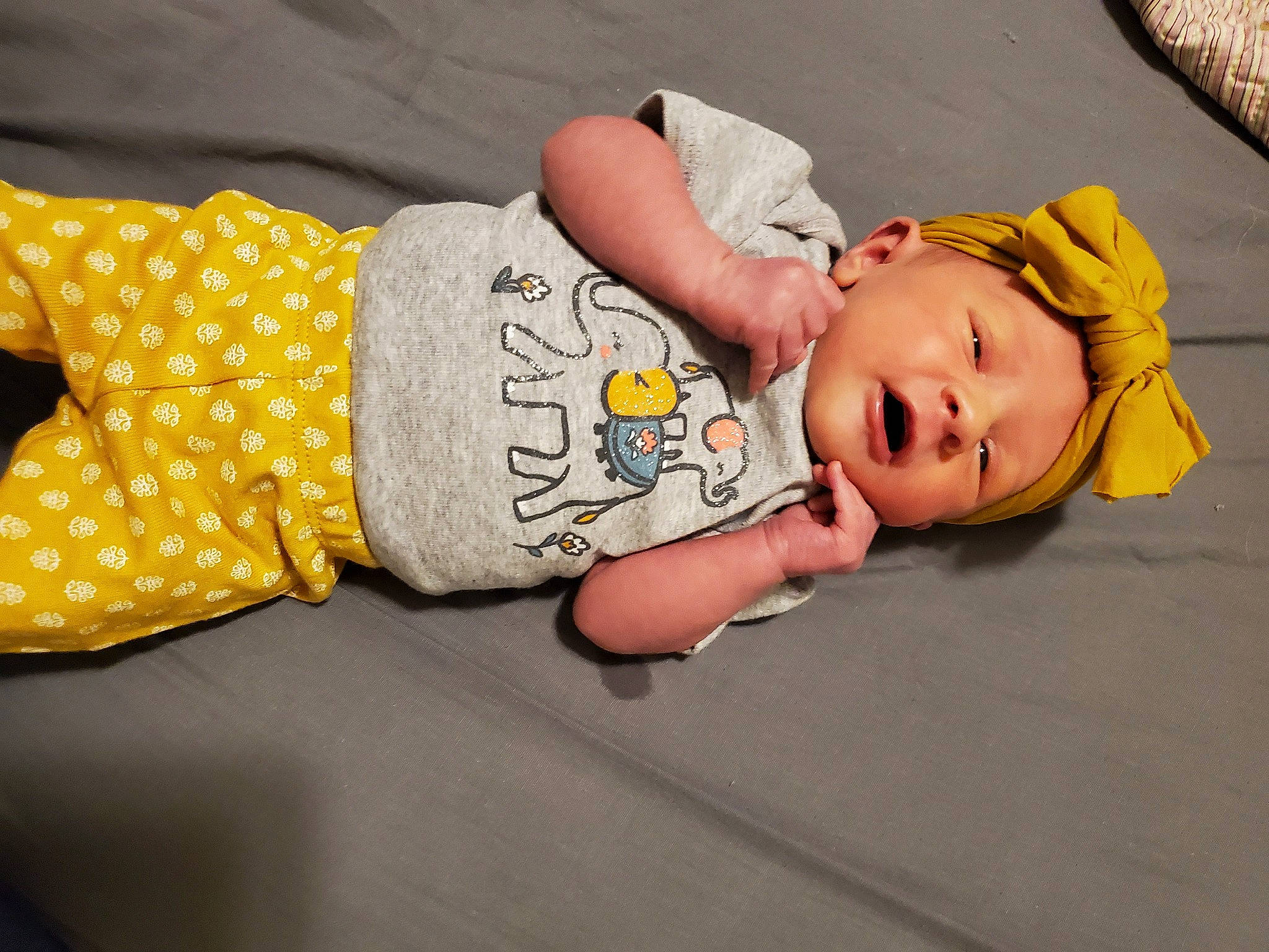 Korra is registered to the contest to win money with this photo: baby, baby_products, baby_toddler_clothing, child, headwear, human, nightwear, person, polka_dot, toddler, yellow