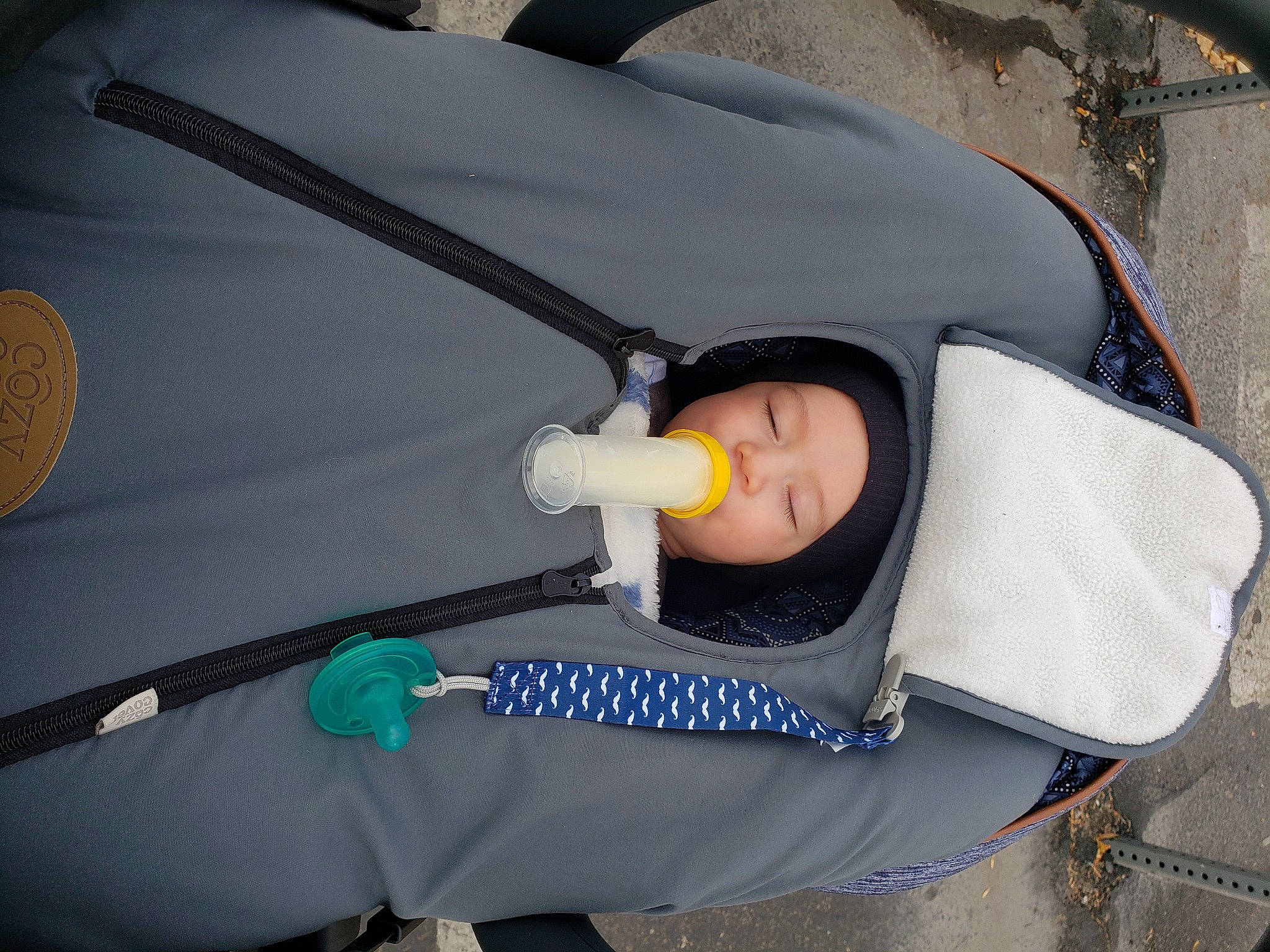 Leroy is registered to the contest to win money with this photo: baby, baby_carriage, baby_products, baby_safety, baby_toddler_clothing, car_seat, child, comfort, headwear, infant_bed, person, sleep, toddler, tree