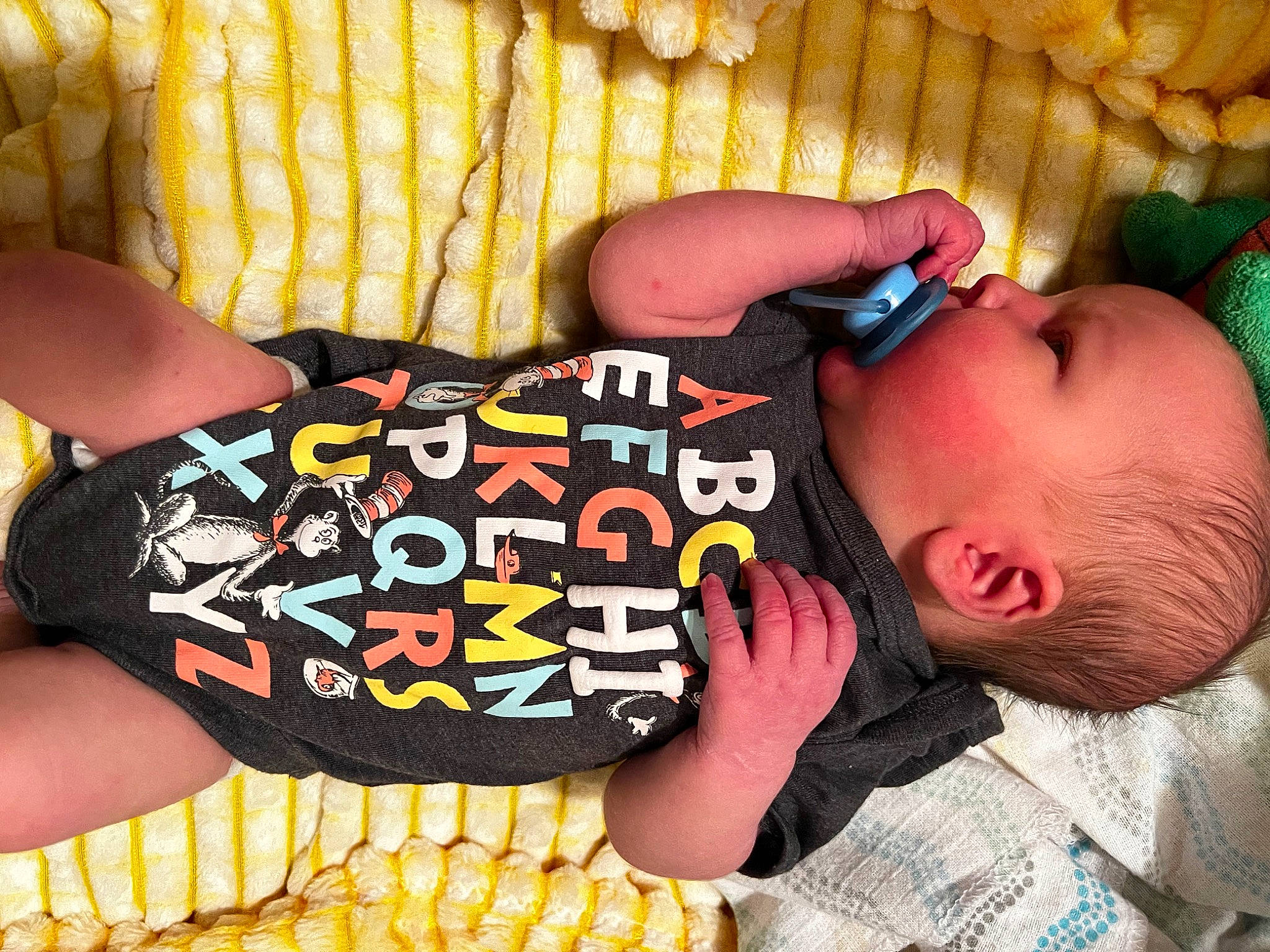 Reed joined the competition — help win amazing prizes! arm, baby, baby_toddler_clothing, black, cheek, cool, finger, glasses, hand, head, human_body, mammal, mouth, orange, person, photograph, sleeve, textile, thigh, toy