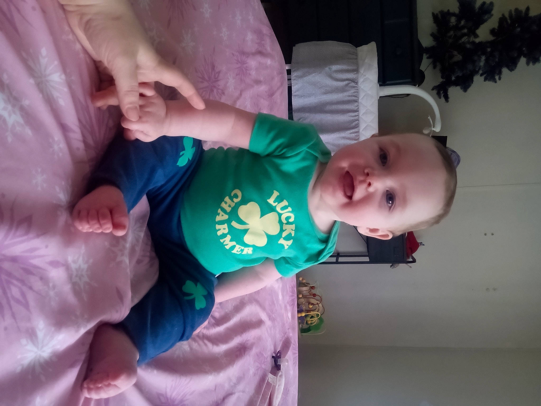 Rayne is registered to the contest to win money with this photo: baby, baby_toddler_clothing, cheek, child, comfort, eye, face, fun, happy, houseplant, human_body, mammal, mouth, person, pink, plant, skin, sleeve, smile, toddler