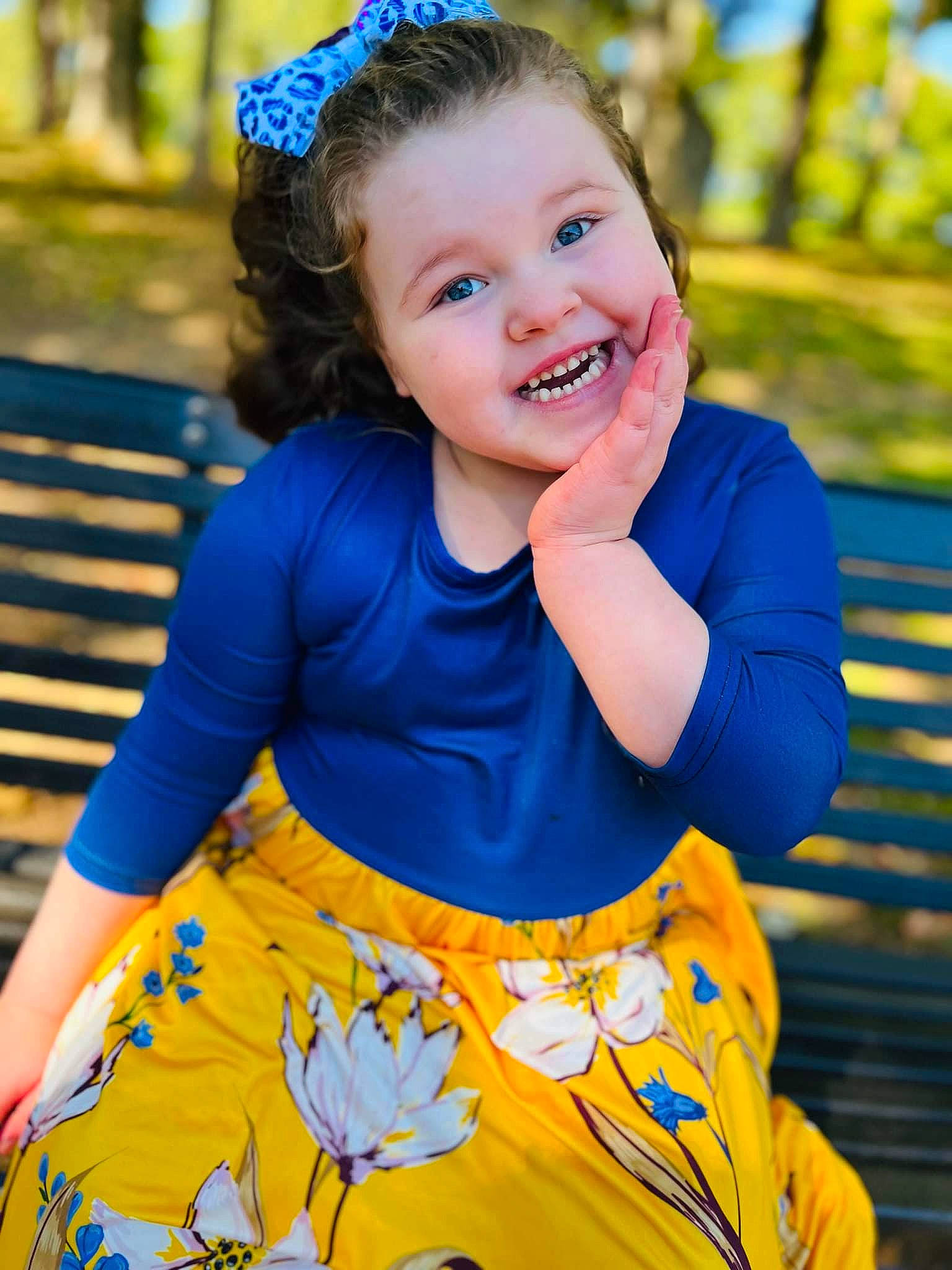 Elizabeth is registered to the contest to win money with this photo: blue, dress, eye, face, facial_expression, flash_photography, fun, grass, green, hair, hairstyle, happy, head, iris, joy, leaf, people_in_nature, person, plant, smile