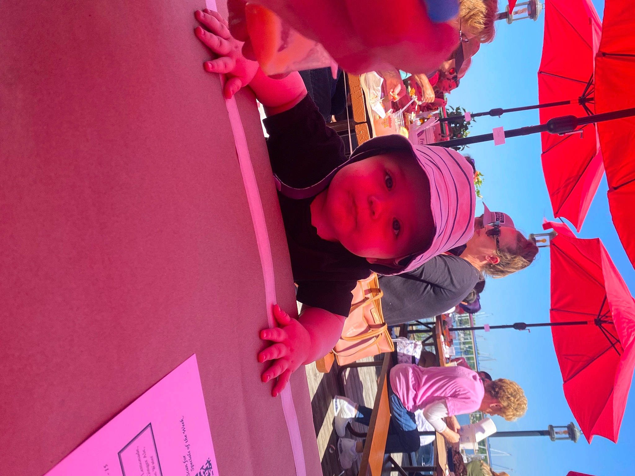 Kingsley is registered to the contest to win money with this photo: balloon, child, entertainment, event, fun, happy, hat, headwear, helmet, leisure, magenta, person, pink, plant, public_event, purple, recreation, red, sky, sunglasses