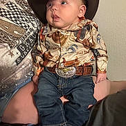 Weston joined the competition — help win amazing prizes! baby, child, cowboy_hat, jeans, boots, belt, western_shirt, indoor, person, infant, cute, portrait, sitting, clothing, hat, face, young_child, casual, people, closeup