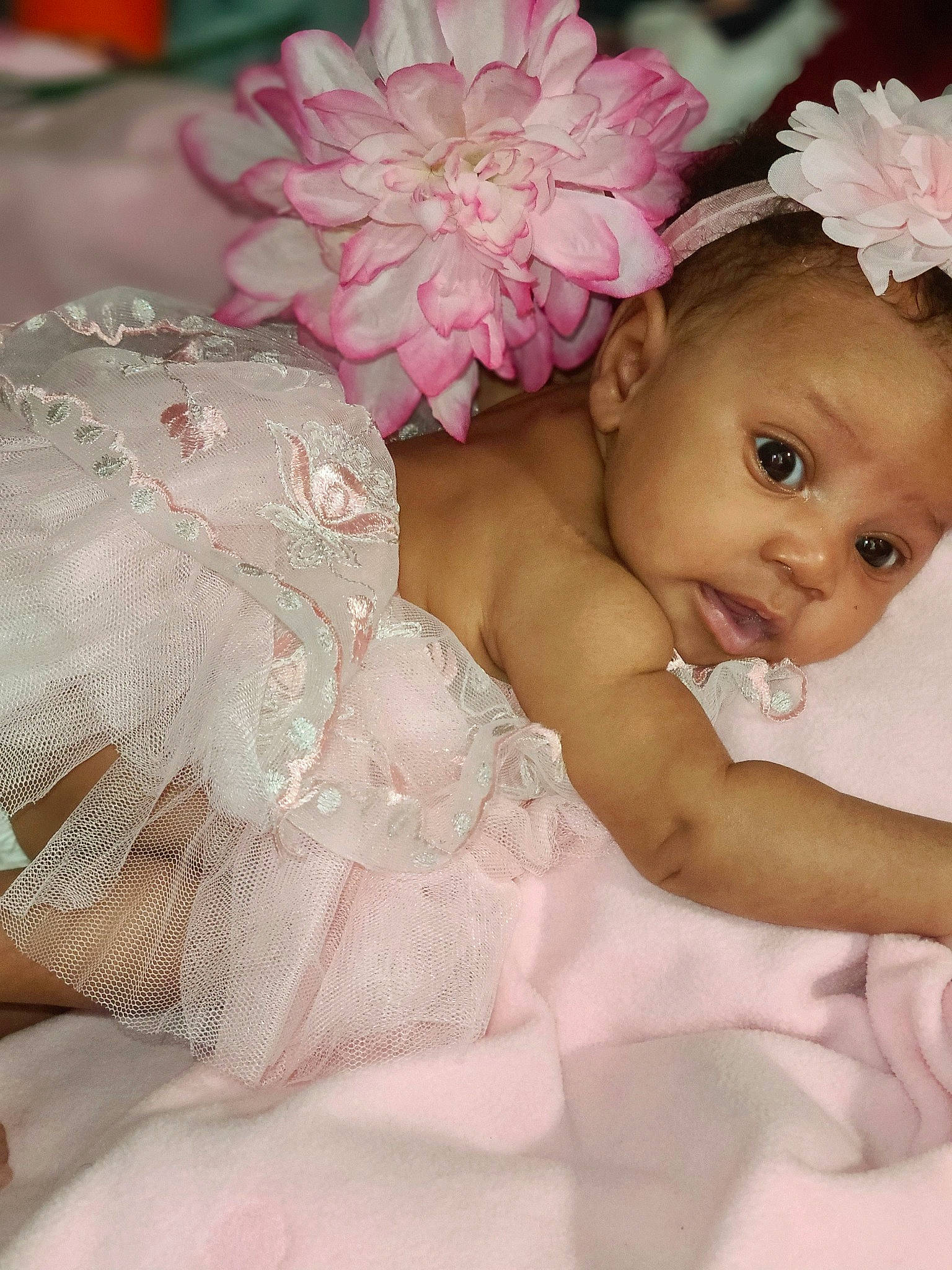 Leilani joined the competition — help win amazing prizes! baby, baby_toddler_clothing, bridal_accessory, child, cut_flowers, dress, embellishment, flower, hair_accessory, happy, headband, headgear, headpiece, peach, person, petal, pink, plant, sweetness, toddler