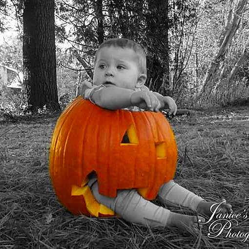 Cindy is registered to the contest to win money with this photo: _and_melon_family, _gourd, calabaza, child, costume, cucumber, cucurbita, fruit, gourd, jack_o_lantern, person, plant, pumpkin, smile, squash, toddler, tree, vegetable, winter_squash