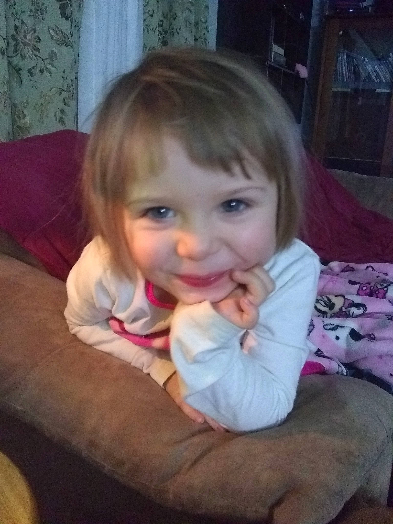 Melina is registered to the contest to win money with this photo: baby, blond, brown_hair, cheek, child, electronic_device, eye, face, finger, fun, hair, head, iris, lip, mouth, nose, person, sitting, skin, smile