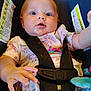 baby, blue_eyes, car_seat, child, child_seat, close_up, curious, cute, drool, expression, floral_clothing, indoors, infant, pink, portrait, safety_harness, seat_belt, small_hands, toy, white
