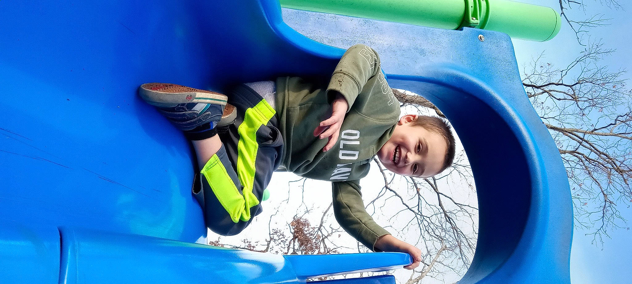 Mason is registered to the contest to win money with this photo: adventure, automotive_exterior, blue, boats_and_boating_equipment_and_supplies, bounce_house, bumper, electric_blue, fun, glove, inflatable, inflatable_boat, job, joy, leisure, motor_vehicle, person, personal_protective_equipment, recreation, smile, sports