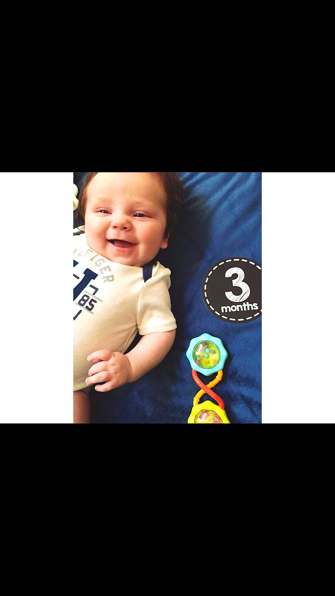 Lyle is registered to the contest to win money with this photo: baby, child, cool, facial_expression, fictional_character, happy, head, person, photo_caption, photography, sky, smile, t_shirt, toddler, yellow