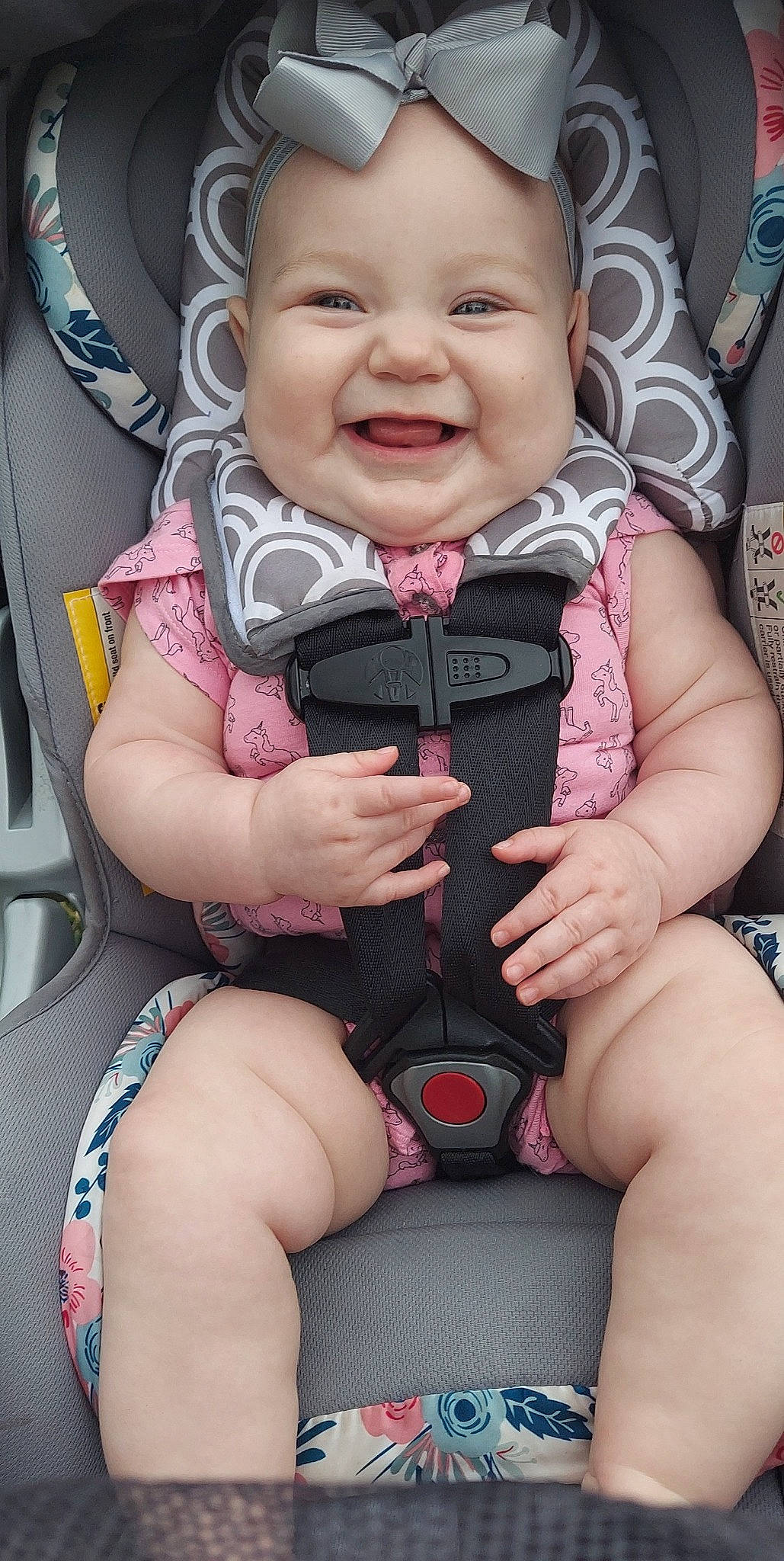 Evangeline is registered to the contest to win money with this photo: baby, baby_carriage, baby_safety, baby_toddler_clothing, cheek, comfort, eye, finger, hand, head, headwear, joy, leg, mouth, organ, person, photograph, pink, skin, smile