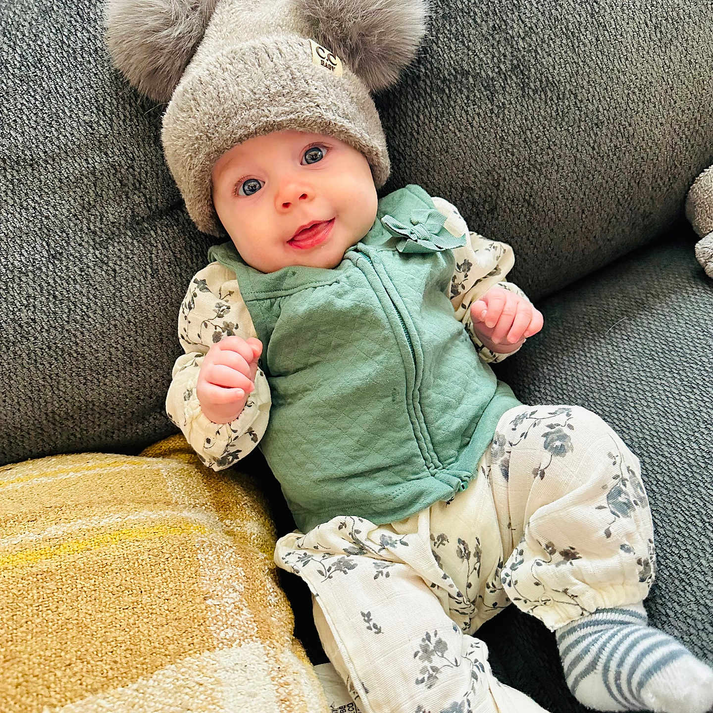 Rosie joined the competition — help win amazing prizes! baby, bonnet, cap, clothing, couch, cushion, face, furniture, glove, hat, head, homedecor, hosiery, newborn, pants, person, photography, portrait, sitting, sock