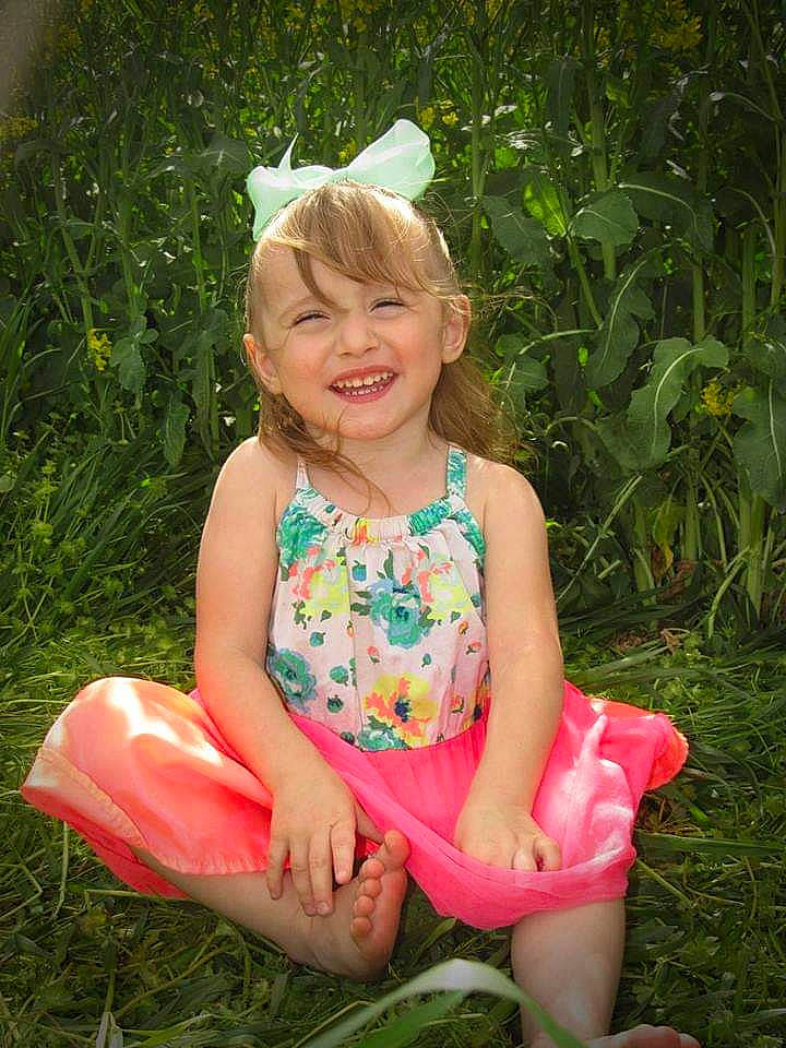 Lee'Anna is registered to the contest to win money with this photo: child, child_model, fawn, grass, headgear, joy, person, pink, plant, sitting, smile, summer, toddler