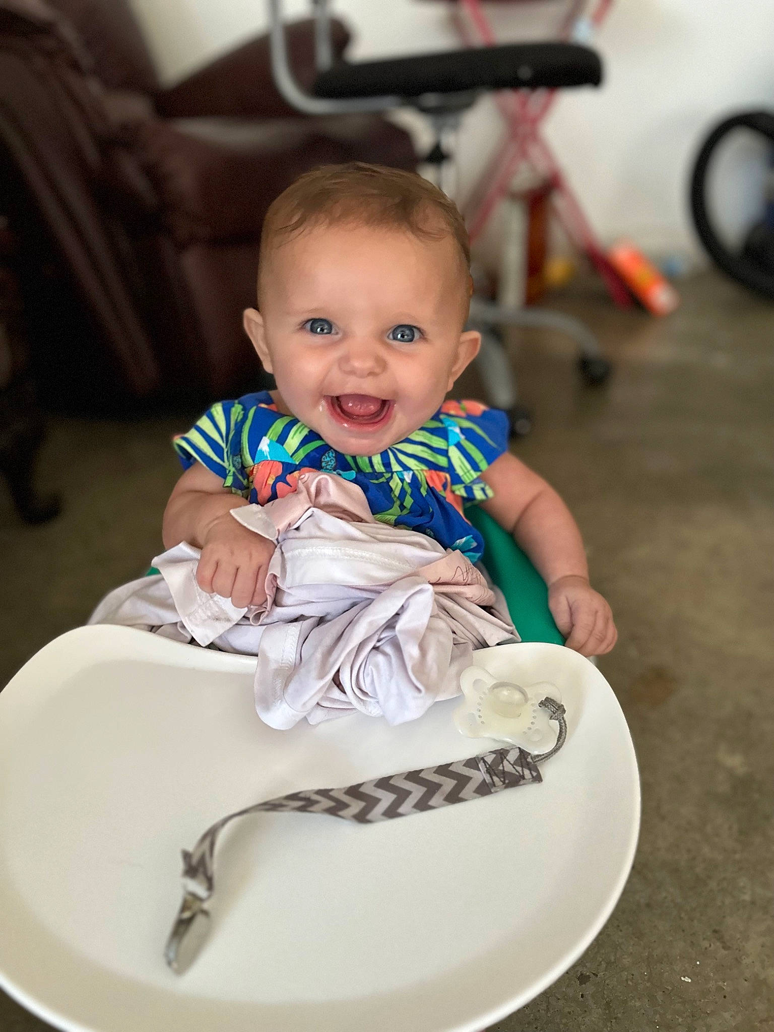 Hazleigh is registered to the contest to win money with this photo: baby, baby_toddler_clothing, chair, cheek, child, comfort, dishware, dress, event, eye, fun, happy, person, plate, sitting, skin, smile, table, tire, toddler