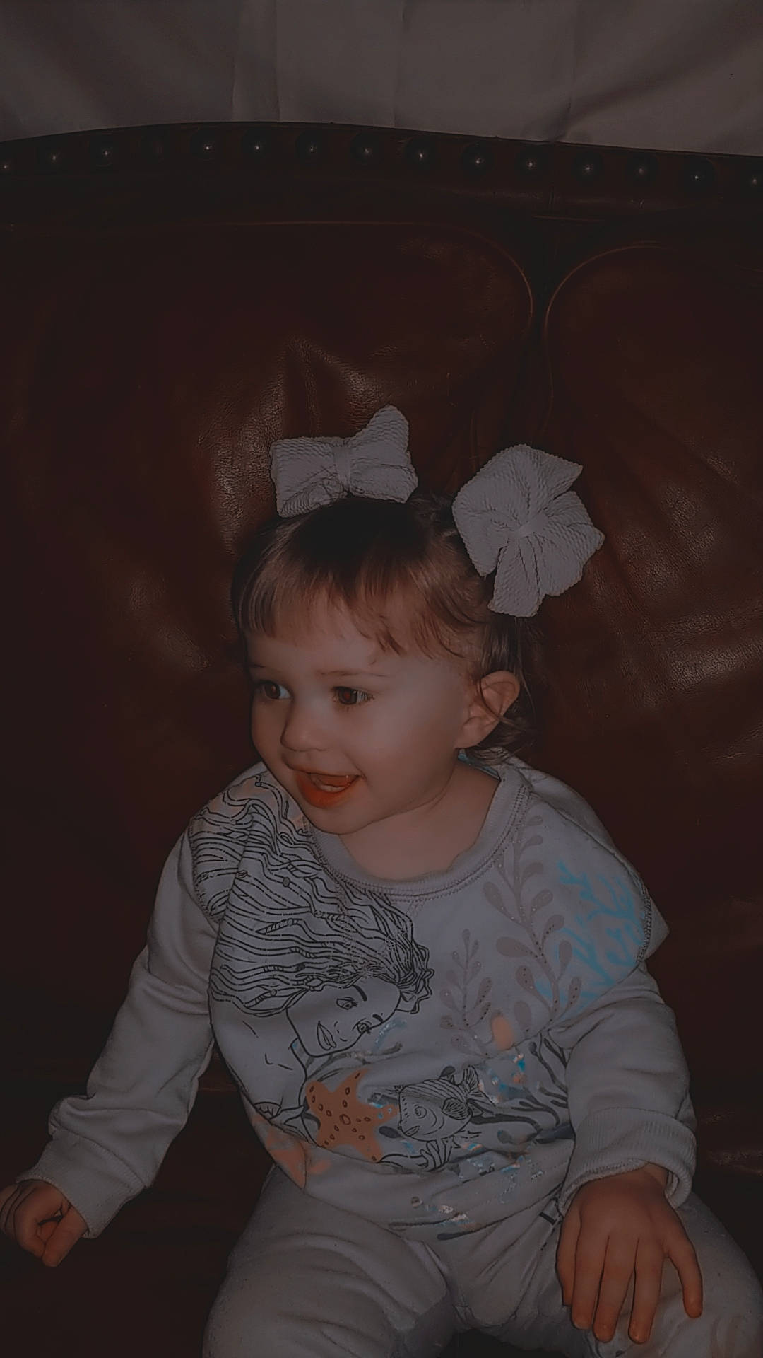 Karsyn is registered to the contest to win money with this photo: baby, baby_toddler_clothing, cheek, child, costume_hat, darkness, fashion_accessory, flash_photography, fun, happy, headgear, pattern, person, portrait_photography, sitting, sleeve, smile, t_shirt, tints_and_shades, toddler