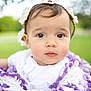 baby, child, flower_crown, blanket, purple, white, outdoor, portrait, closeup, cute, infant, face, soft_focus, nature, greenery, young, innocent, headwear, expression, curious