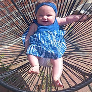Kataléya a rejoint le concours — aidez-le/la à gagner de superbes lots ! baby, blue_dress, brick_wall, chair, child, cute, fashion, feet, happy, headband, infant, legs, metal, outdoor, person, playful, seat, shadow, smiling, sunlight