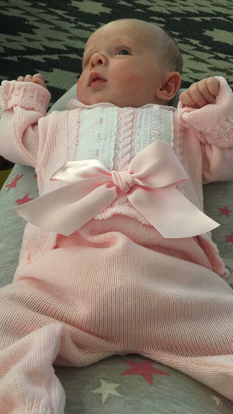 Scarlett joined the competition — help win amazing prizes! baby, baby_products, baby_toddler_clothing, bow_tie, child, collar, comfort, dress, dress_shirt, grass, happy, linens, pattern, peach, person, pink, skin, sleeve, textile, toddler
