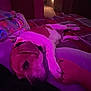 Hulk is registered to the contest to win money with this photo: dog, bed, hand, blanket, indoor, purple_lighting, resting, pet, cozy, carpet, human_hand, collar, comfort, warm_light, room, furniture, relaxation, animal, sleepy, domestic