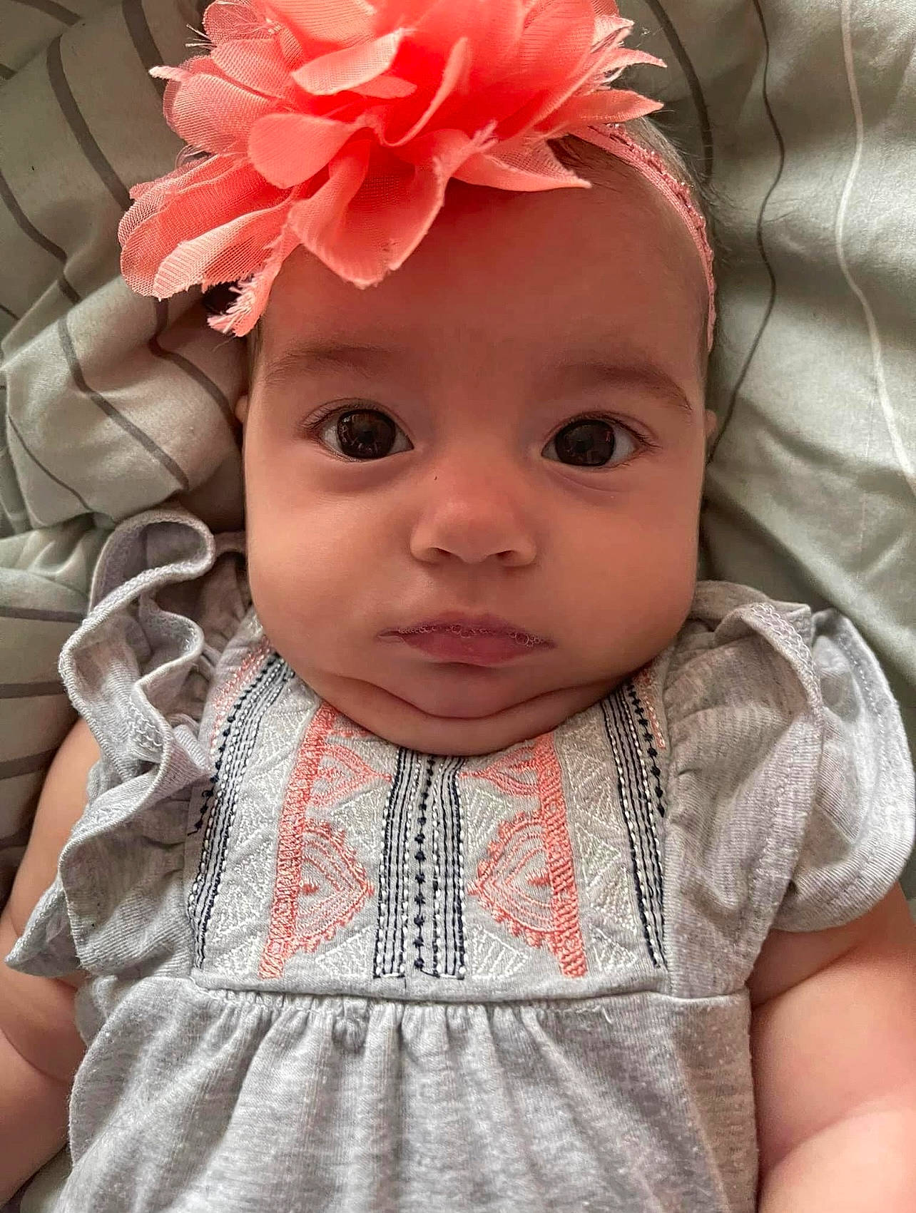 Amiya is registered to the contest to win money with this photo: baby, baby_toddler_clothing, cheek, dress, eye, eyelash, face, flower, happy, hat, head, headwear, human_body, iris, lip, person, petal, pink, skin, sleeve